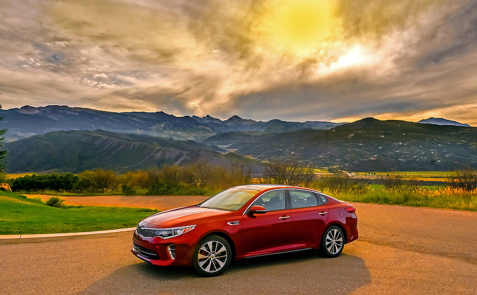 red sedan on road during sunset HD wallpaper