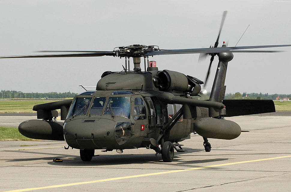 grey and black helicopter on landing area HD wallpaper