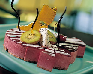 cake with sliced kiwi and dragon fruit