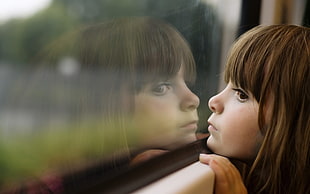 girl staring outside the window