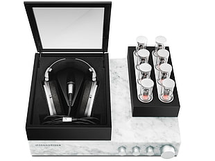 silver and black corded headphones in box
