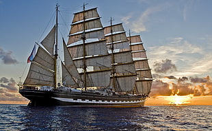 brown sail ship, sea