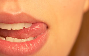 close view of a woman's mouth with tongue's out