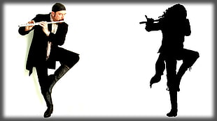 man in black suit playing flute