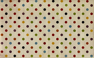 white and multicolored polka-dotted textile
