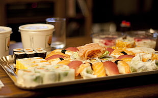 assorted sushi serve on gray plate