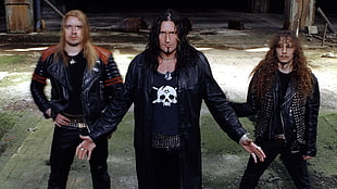 three long haired male wearing black leather jackets