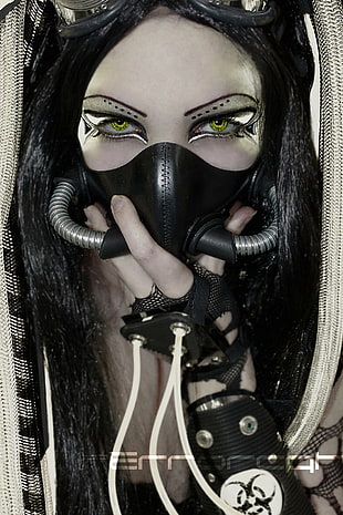 woman wearing black gas mask