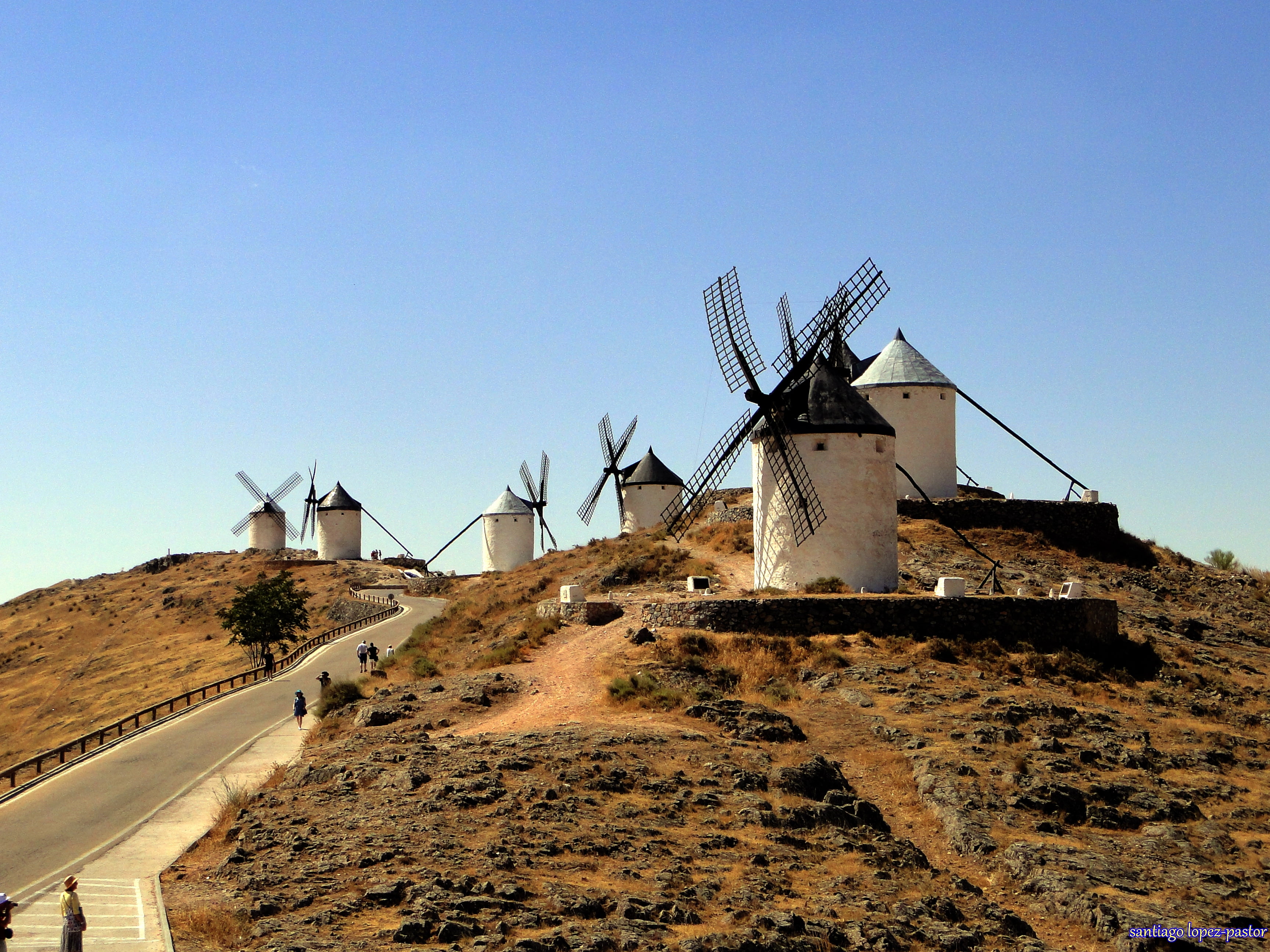 five white concrete windmills during daytime, consuegra