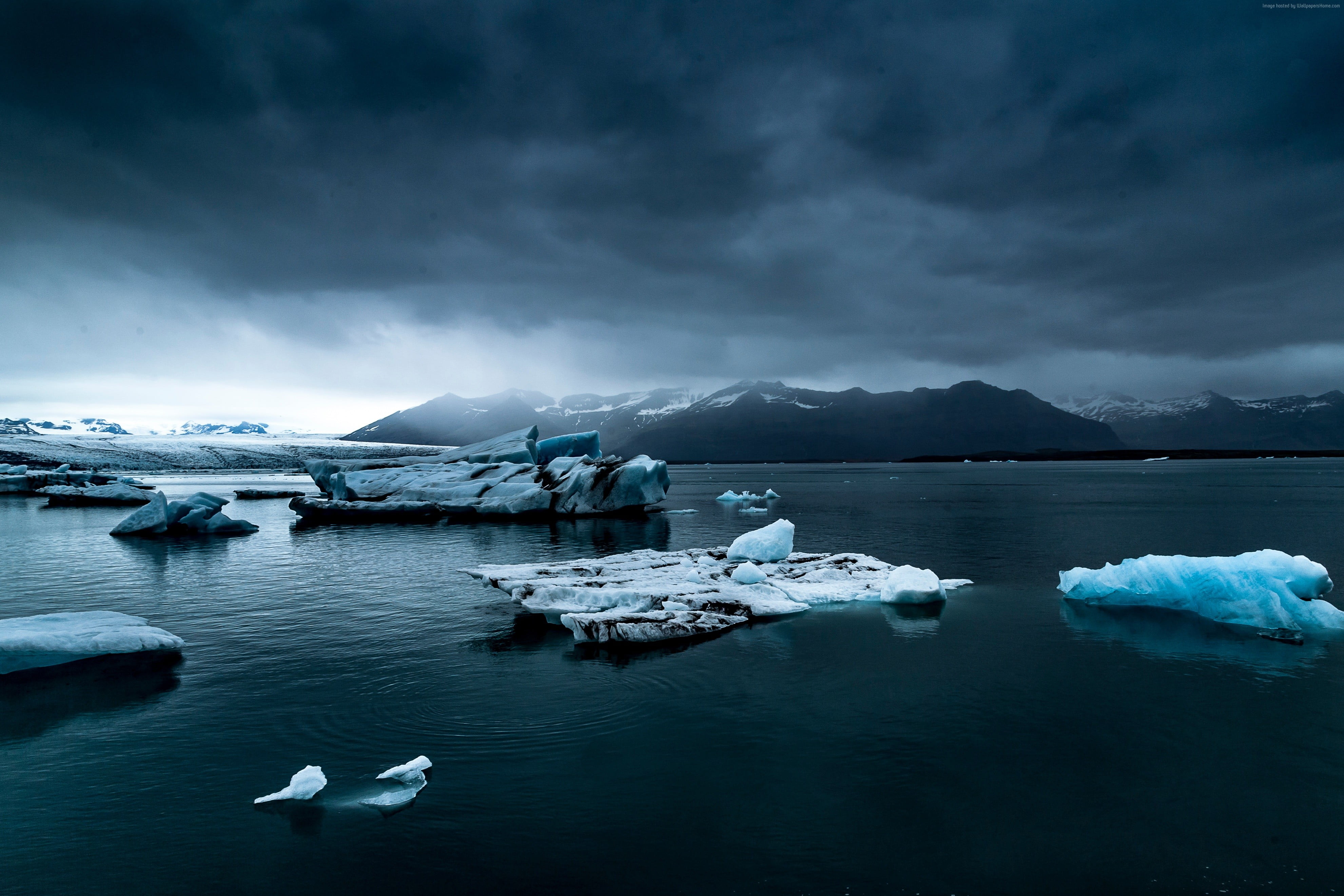 photography of ice rock on body of water