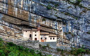 beige house on rock