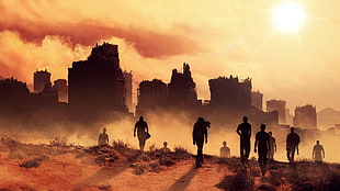 people walking in barren place heading on black building during golden hour HD wallpaper