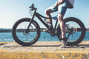 man riding mountain bicycle