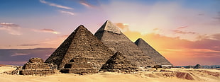 six Pyramids on brown sand during daytime HD wallpaper