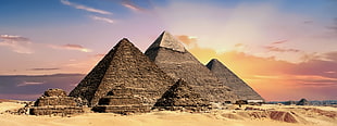 six Pyramids on brown sand during daytime
