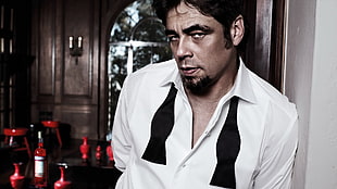 man wearing white and black button-up collared shirt