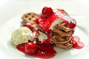 chocolate waffle with whip cream and cherry on top