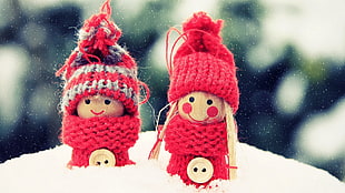 two red knit dolls, toys, snow