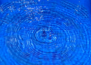 crystal clear water in blue container