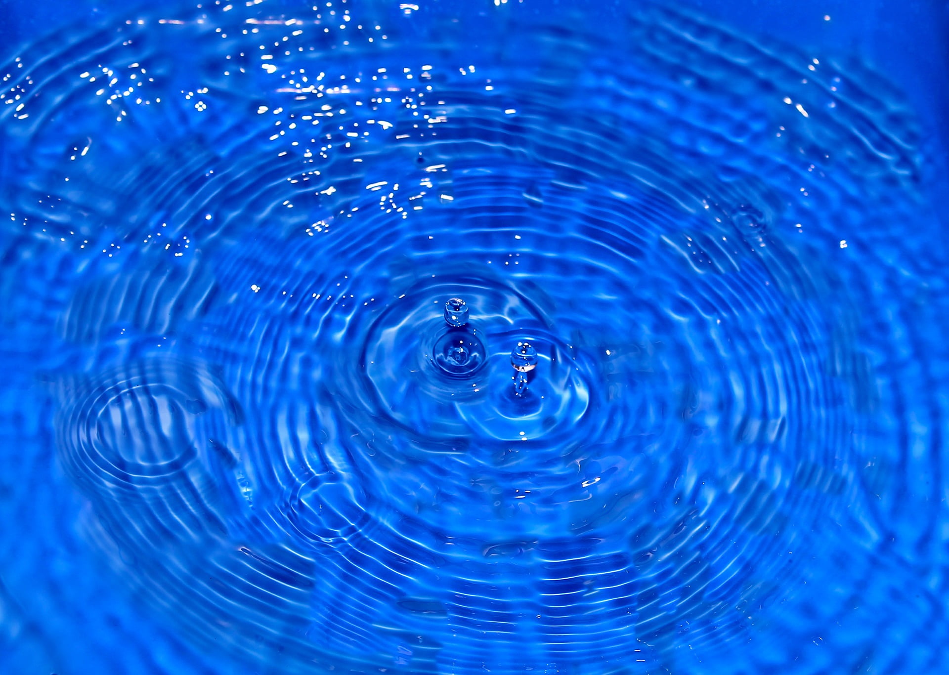 crystal clear water in blue container