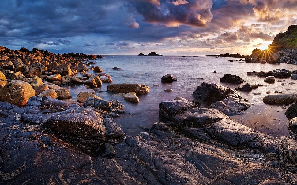 rocky beach side HD wallpaper