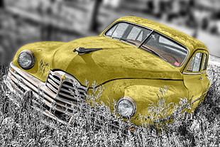 yellow car on selective grayscale photography