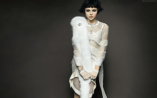 woman wearing white and gray lace dress and white scarf