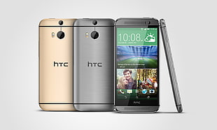 silver and gold HTC smartphones