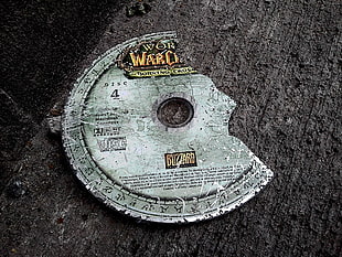 World of War Craft Disc on gray surface