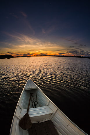 white boat sailing with sunrise background, amazonas