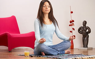 woman meditating near chair inside room HD wallpaper