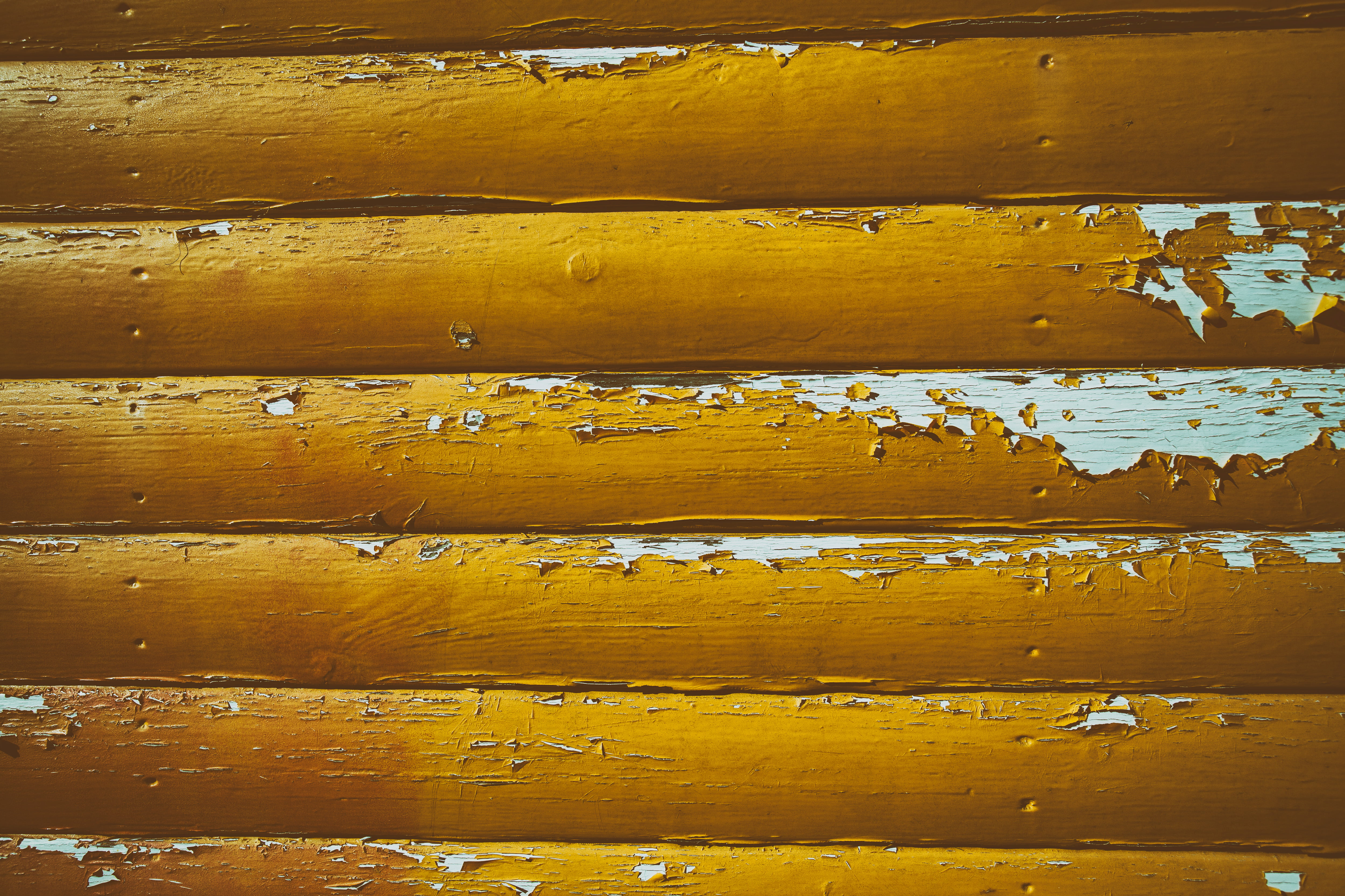 closeup photo of yellow painted wooden wall