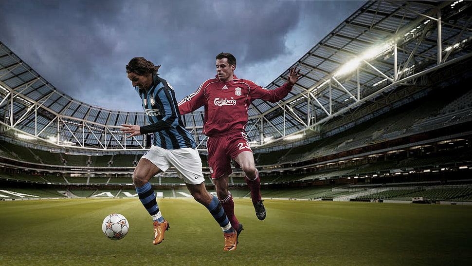 two soccer player playing on stadium under gray clouds HD wallpaper