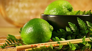 two green citrus fruits and chopsticks, lime, fruit HD wallpaper