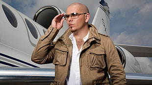 man in gray full-zip jacket wearing sunglasses