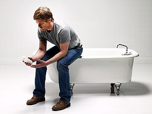man on freestanding bathtub
