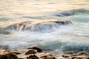 waves on rocks on seashore HD wallpaper