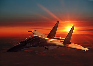 brown jetplane with sunrise background photo