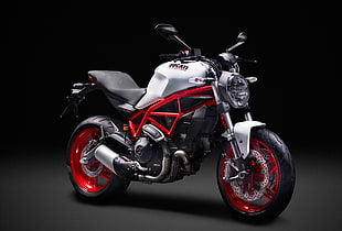 gray, black, and white Ducati motorcycle