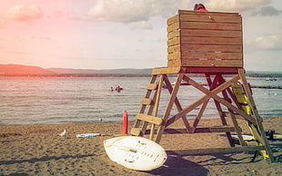 brown wooden windsor rocking chair, beach, water