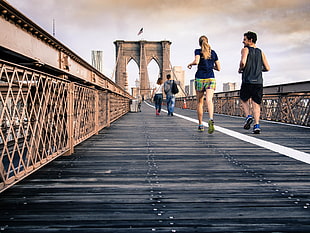two person jogging at London bridge HD wallpaper
