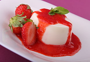strawberry cheesecake served on white plate