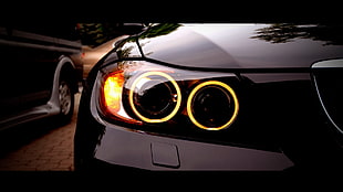 closeup photo of car's right auto headlight