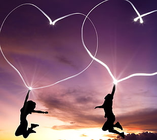 two people jumping with heart photo, happy
