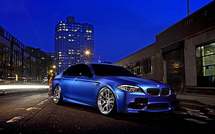 blue BMW sedan, car
