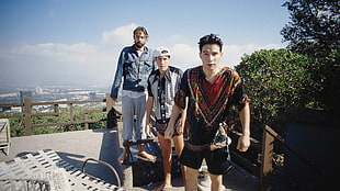 three men standing outdoor during daytime HD wallpaper