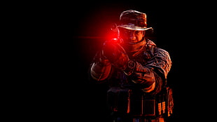 soldier holding laser pointer sign pistol