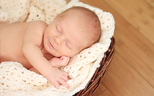 shallow focus photography of sleeping baby
