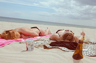 two woman during sunbathing HD wallpaper