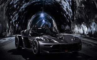 grey sports coupe in tunnel